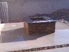 black-granite-firepit-in-landscape