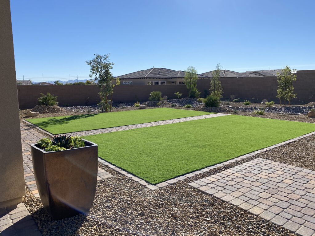 Synthetic turf with paver walkway