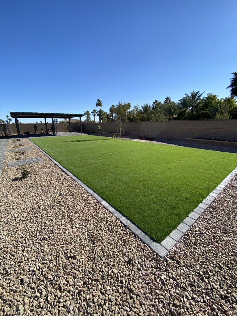 Backyard landscape with synthetic turf